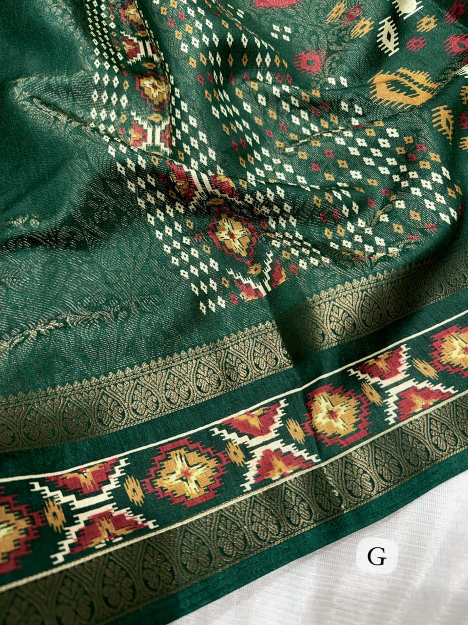 Green color Ajrakh Patola Print Jacquard Border Saree with Unstitched Blouse