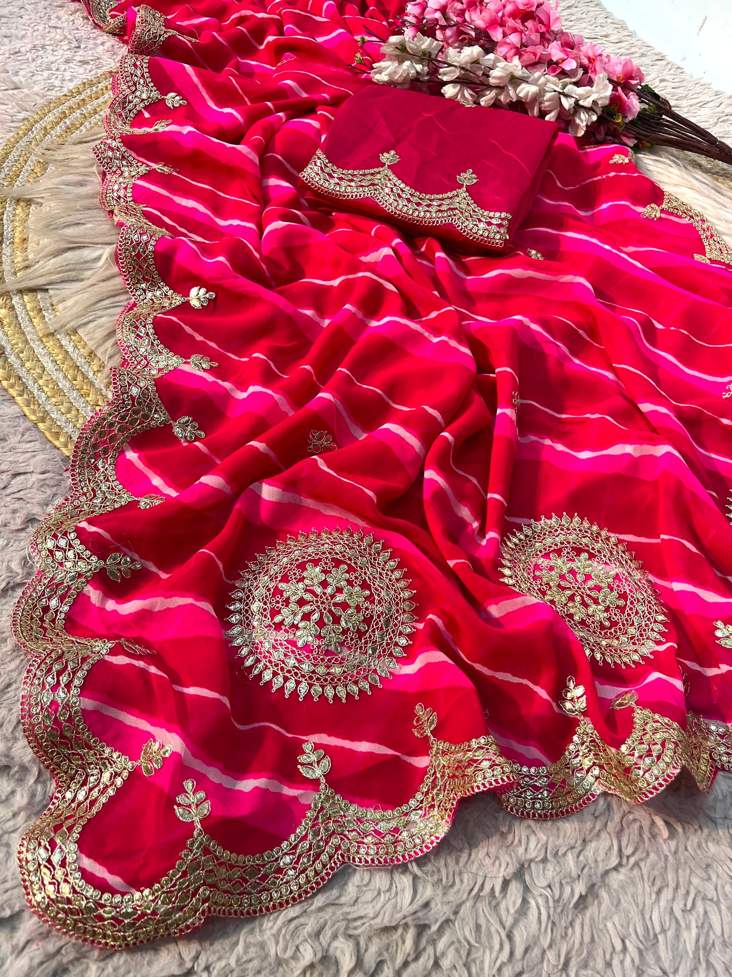 Rani Pink color Lehriya Print Saree with Unstitched Blouse