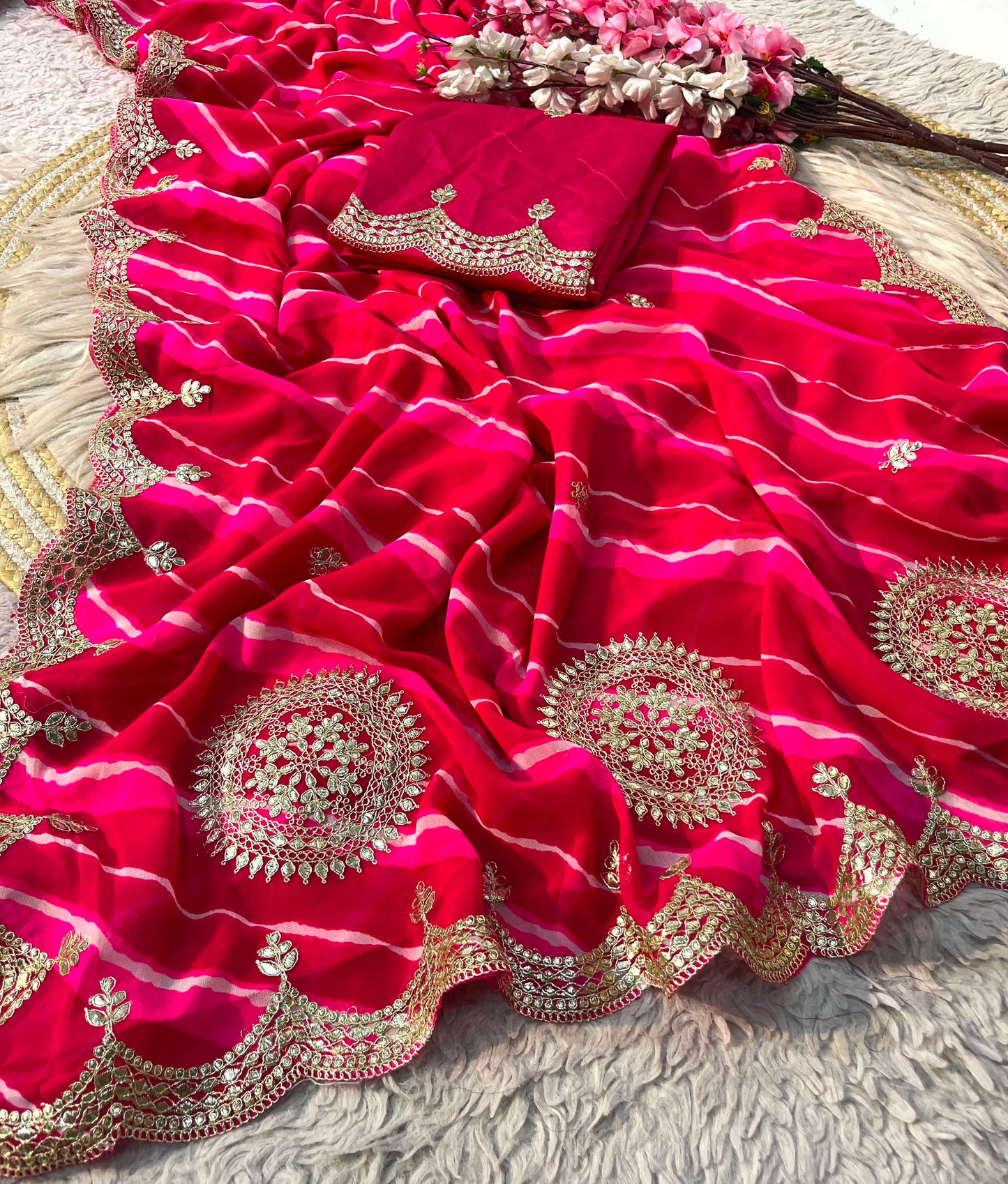 Rani Pink color Lehriya Print Saree with Unstitched Blouse